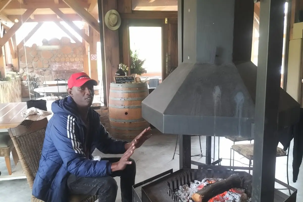 Warming up by the fire at a lodge
