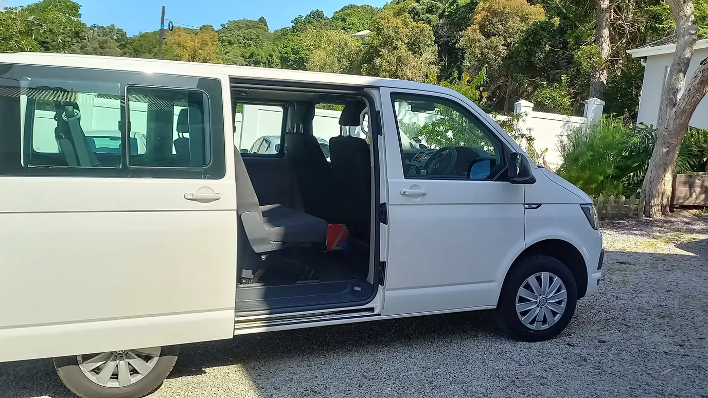 The Jonas Gidwa Tours transfer vehicle, side door open